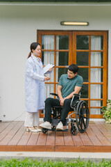 Doctor Consulting with Patient in Wheelchair