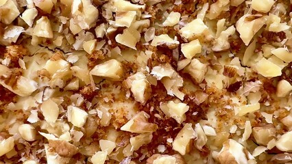 Deliciously Baked Walnut Dessert Topped with a Crunchy and Flavorful Topping Delightfully