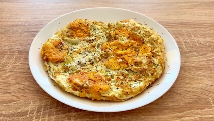 A Truly Delicious and Flavorful Egg Omelette Dish Created with Fresh and Aromatic Herbs for Eating