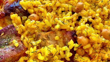 Enjoy a flavorful Yellow Rice Dish with meat and chickpeas, perfect for any meal