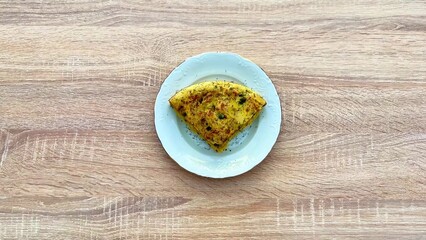 A delicious egg dish beautifully presented on a pristine white plate for your enjoyment