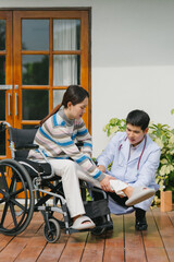 Naklejka premium Doctor Examining Patient's Leg in Wheelchair