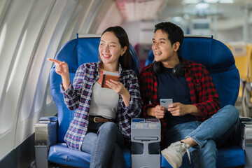 Couple Traveling by Airplane