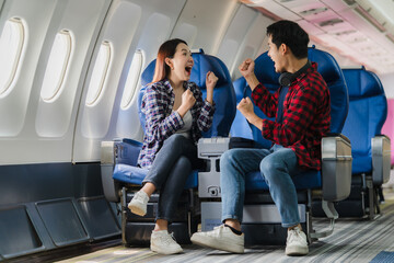 Excited Couple Traveling by Airplane