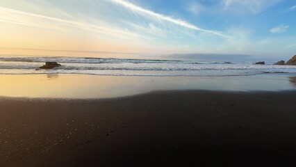 Experience the breathtaking serenity of a beautiful beach sunset over gentle ocean waves