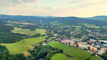 Obraz premium A Beautiful Aerial View of a Serene and Picturesque Landscape Featuring Rolling Hills and a Town