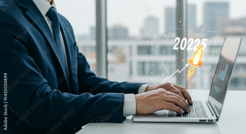 Poster man in suit typing on laptop with rocket graphic and cityscape in the background near window