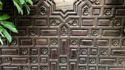 An Intricate Wooden Wall Design that Features an Abundance of Lush and Vibrant Foliage