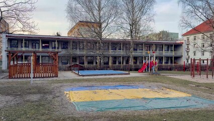 Playground Area Located in Close Proximity to a School Building for Various Activities