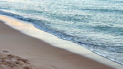 Experience the Serene Beach Waves that Gently Lapping at a Tranquil and Peaceful Shoreline