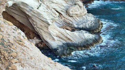 Explore the stunning coastal rock formations that lie beautifully beneath the clear waters