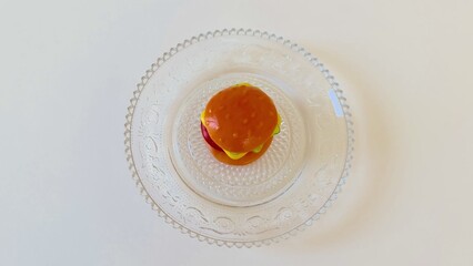 A Delicious Mini Burger served on an Elegant Glass Plate, perfect for any occasion
