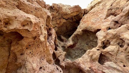 A Beautifully Textured Rocky Cliff Featuring Unique and Breathtaking Natural Formations