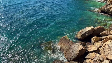 Experience the breathtaking majesty of stunning cliffs and turquoise waters on a sunny day