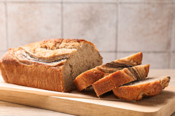 Cut banana bread on wooden table, closeup