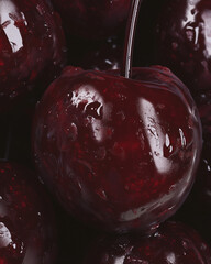 Closeup of cherries with glistening water droplets on them