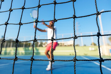 Play tennis. Tennis is a racket sport that is played either individually against a single opponent (singles) or between two teams of two players each (doubles).