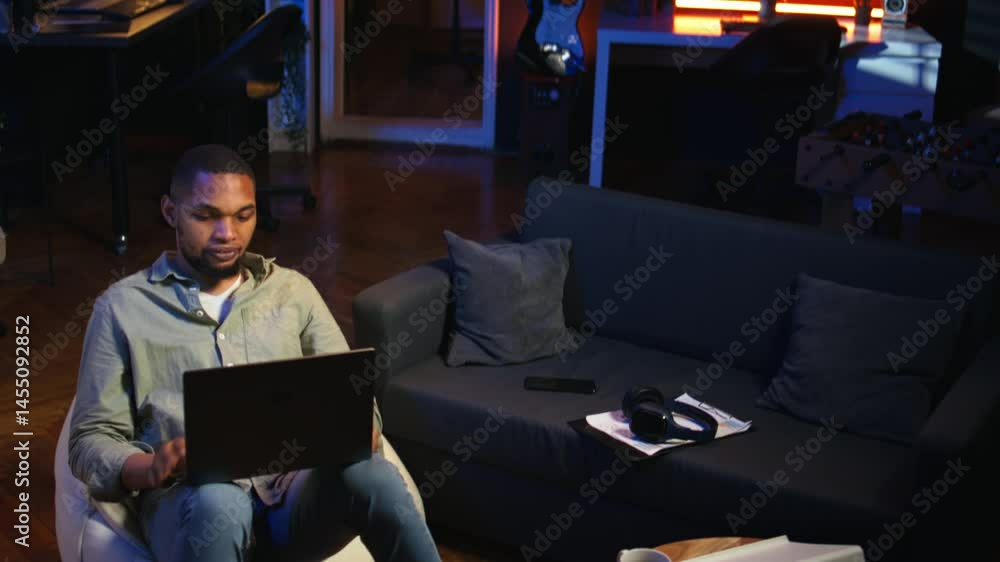 Poster black man joining online lesson to work on new skills from home space, attend web conference call an