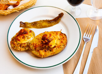 Appetizing stuffed potatoes with boiled egg closeup