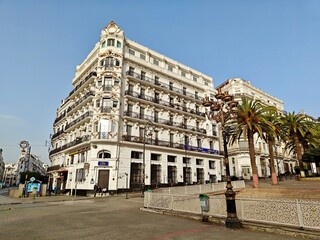 Historic colonial-era building in downtown Algiers, Algeria, featuring ornate balconies and classic...