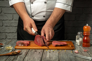 A skilled chef is cutting fresh meat on a wooden board in a cozy kitchen. Various spices, seasonings, and kitchen tools surround the scene, emphasizing the culinary preparation