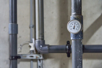 Close-up of a Brass Industrial Pressure Gauge Measuring in Bar