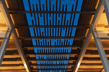 Looking up at a sun shelter with deep blue sky just after sunset. Architectural design concept graphic resource