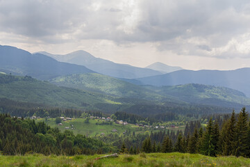 Fototapeta premium Picturesque landscape with village in the Carpathian mountains