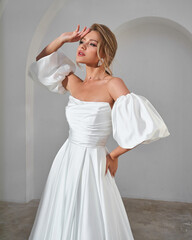Elegant Bride in White Dress with Puffy Sleeves