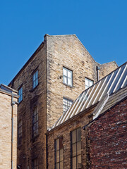 group of typical 19th century old industrial stone buildings in the little germany district of bradford