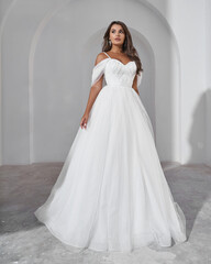 Fototapeta premium Elegant White Wedding Dress with Sparkling Tulle