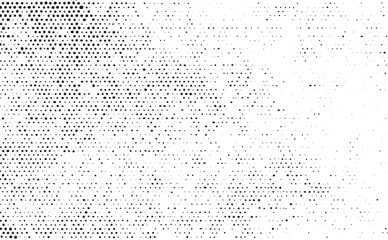 A dense abstract of evenly spaced white dots against a dark background.