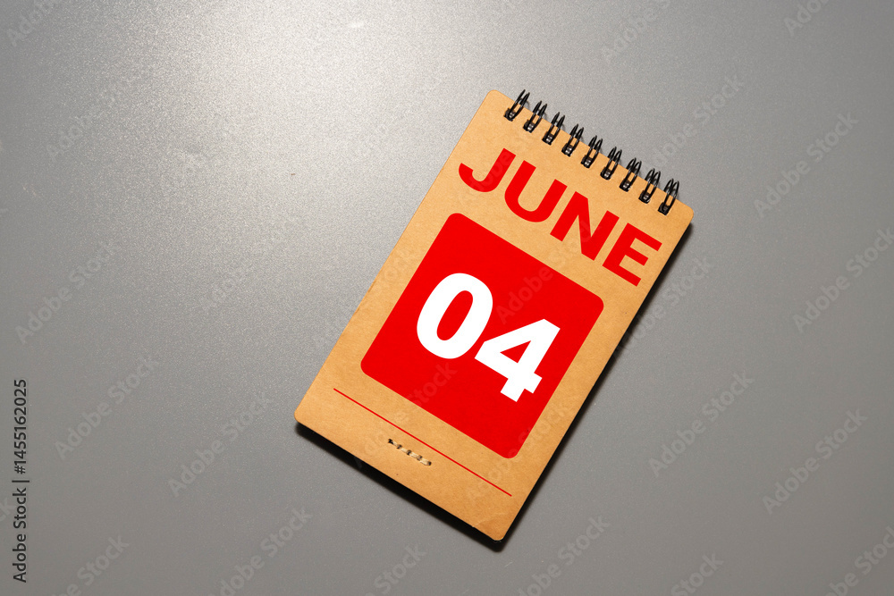 Poster chalkboard with june 04 calendar date on white cube block.