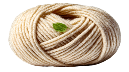 Creamcolored yarn ball with a green leaf natural fiber texture ecofriendly crafting materia