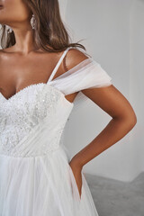 Elegant bride in beaded wedding dress close-up