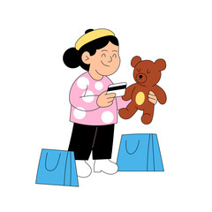 Little girl holding toy bear and credit card during shopping