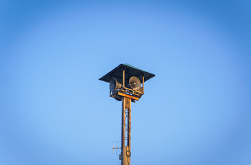 An audio four-way loudspeaker of the broadcasting tower in a village. Voice communication in a...