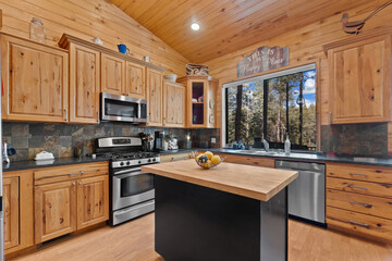 A beautiful kitchen with elegant wooden cabinets and modern appliances