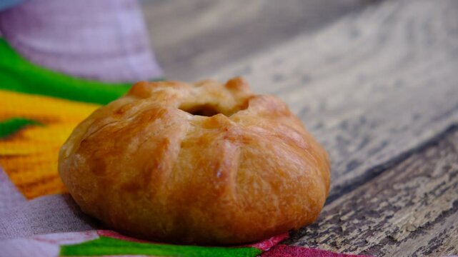 Mongolian buuz, dumplings with meat, savory fried dumplings filled with juicy meat, served on a plate with herb, arugula, tomatoes. Artisanal food