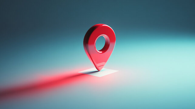 Glossy red location pin hovers over a stark white surface, casting a soft shadow beneath it; a vibrant pop of color in a minimalist space symbolizing direction, presence, and digital navigation.

