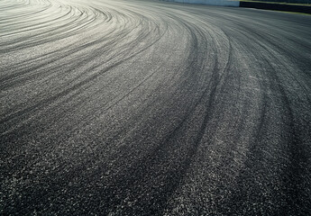 Abstract asphalt texture with tire tracks conveying speed and dynamic movement