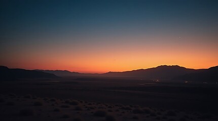 Fototapeta premium Dusk Over the Desert Mountains: A Serene Vista of Twilight Hues Landscape