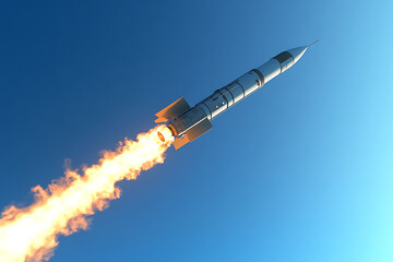 Rocket Launching into Clear Blue Sky with Flames and Smoke, Symbolizing Innovation and Exploration