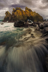 rocky coast at sunset in Kiluan Lampung Indonesia