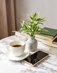 모던한 탁자 위에 책과 휴대폰과 커피 한잔