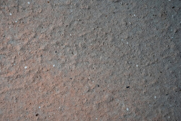 Textured surface of light gray concrete