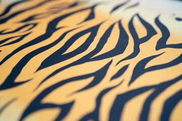 Close-up of vibrant tiger stripe fabric pattern.