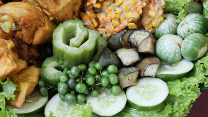 Lalapan. Fresh vegetables like like cucumber, lettuce or watercress, eggplant and basil 