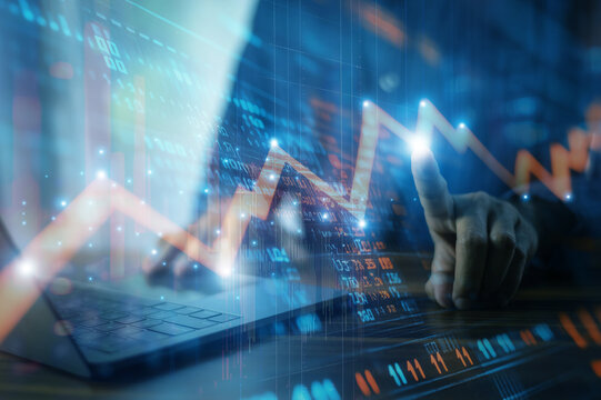 Businessman analyzing investment charts and financial data during periods of high market volatility to make informed decisions