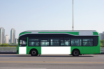 Green bus on the road in Seoul, Bus billboards